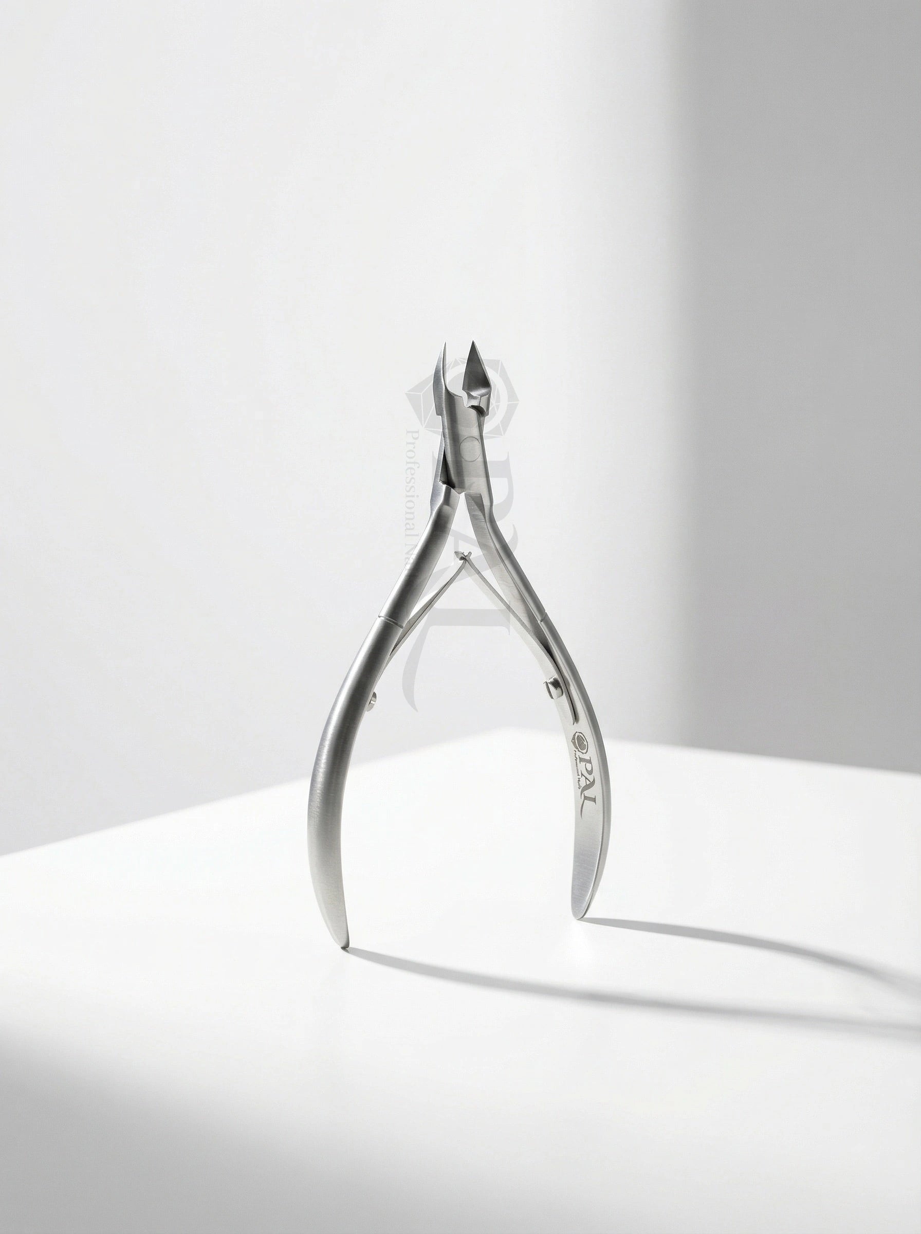 OPAL professional stainless steel cuticle nipper with precision blades and ergonomic spring-loaded handles